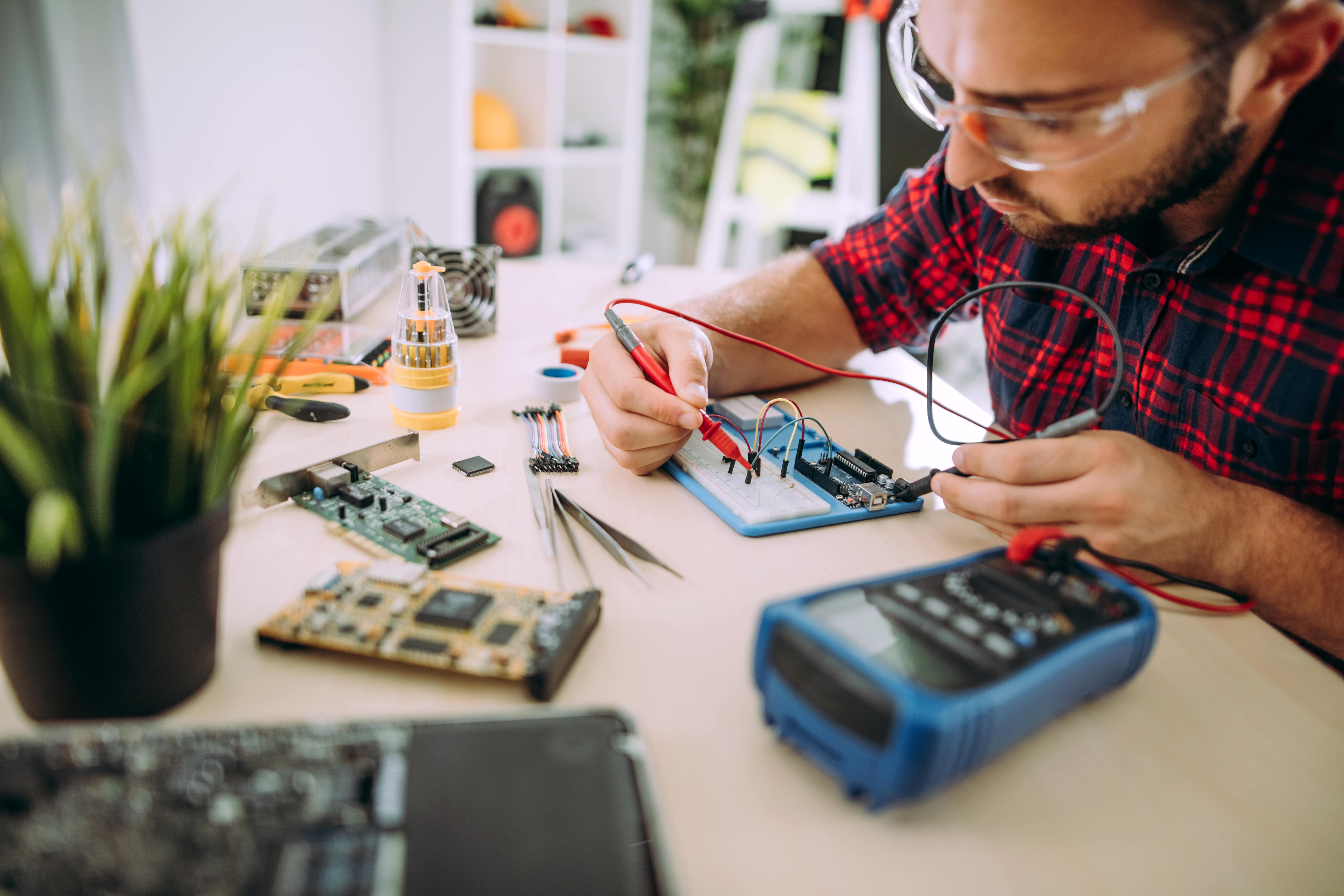 engineer testing with breadboard