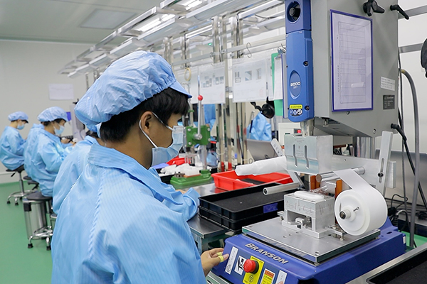 operator using an ultrasonic welding machine