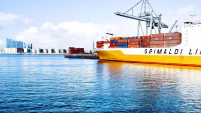 Large Boat at Port with Sea Freight Shipping Containers