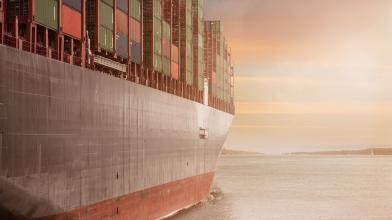 Freight ocean shipment with sunset behind