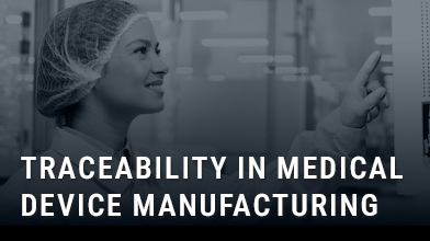 operator in medical device manufacturing factory with words overlaid to say traceability in medical device manufacturing